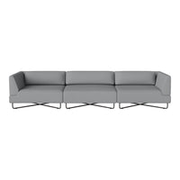 Gray modular sofa with sleek lines and a minimalist design, featuring solid fabric upholstery and metal legs.