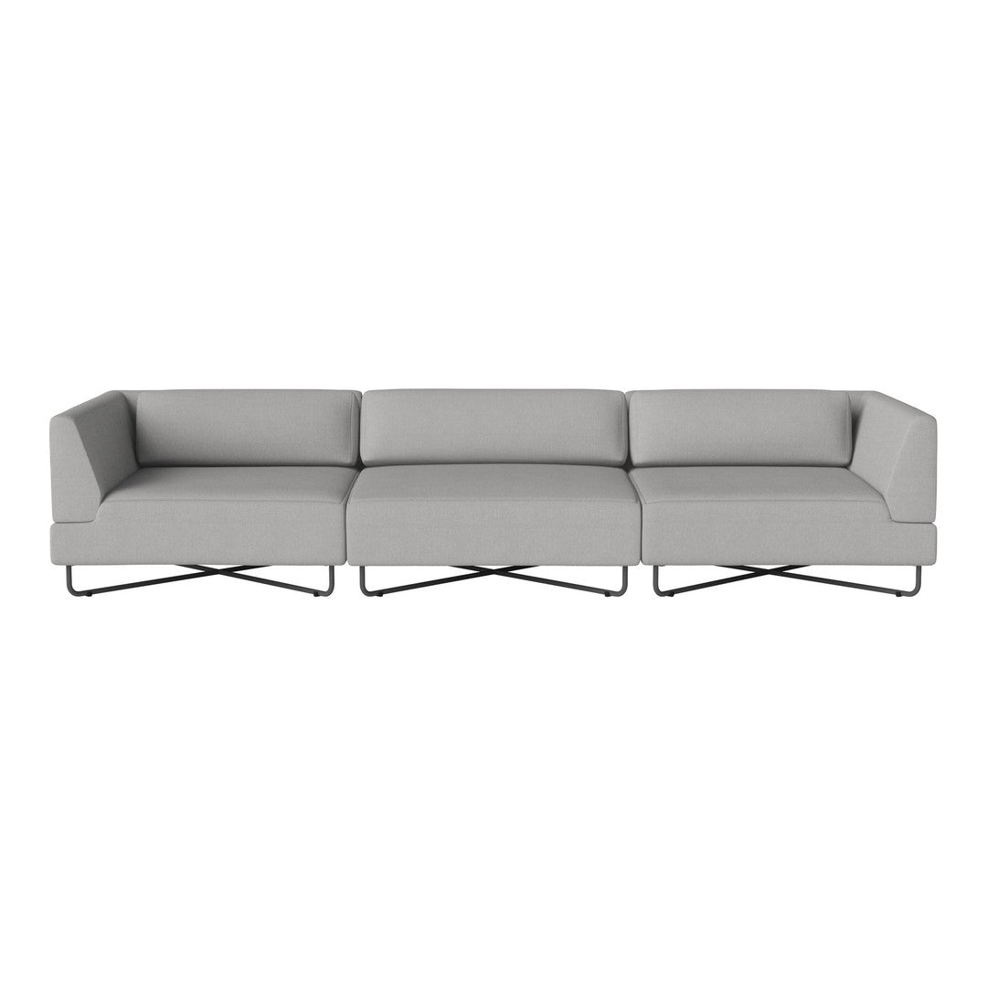 Gray sectional sofa with clean lines and modern design, featuring a minimalist style and bold geometric pattern.