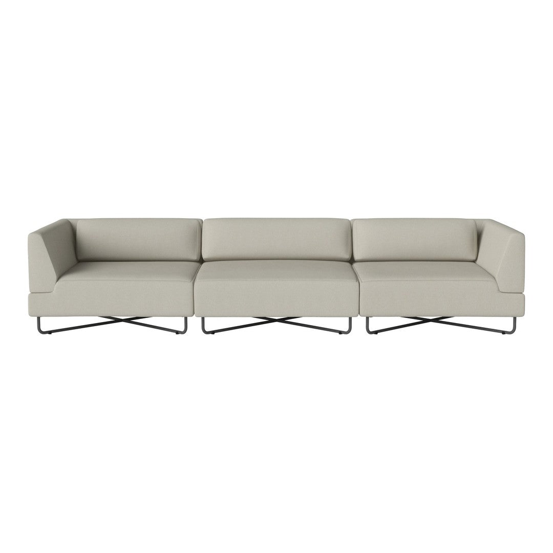 Modern sectional sofa in soft beige upholstery with sleek metal legs and minimalist design.