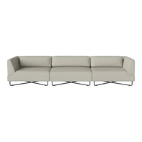 Modern sectional sofa in soft beige upholstery with sleek metal legs and minimalist design.