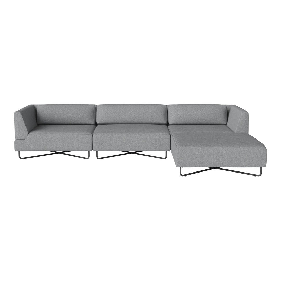 Modern gray sectional sofa with a minimalist design and sleek black legs, featuring smooth fabric upholstery.
