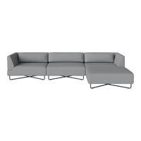 Modern gray sectional sofa with a minimalist design and sleek black legs, featuring smooth fabric upholstery.