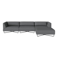 Modern gray sectional sofa with sleek lines and a minimalist design, featuring a solid color and smooth texture.