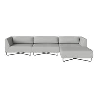 Modern gray sectional sofa with clean lines and minimalist design, featuring a sleek metal base and soft fabric upholstery.