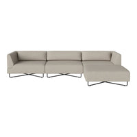 Beige sectional sofa with a minimalist design and smooth fabric texture, featuring sleek black metal legs.