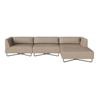 Beige sectional sofa with a minimalist design, featuring clean lines and a smooth fabric texture. Black metal legs.
