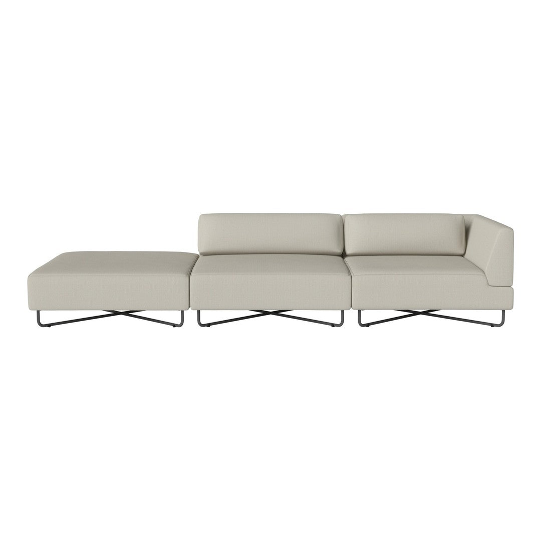 Light beige sectional sofa with a sleek design and smooth fabric texture, complemented by minimalist metal legs.