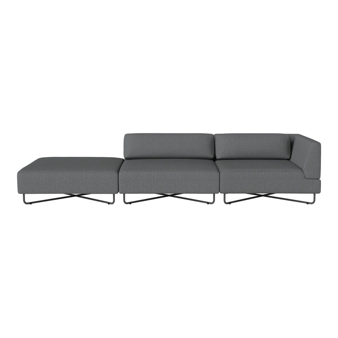 Modern gray sectional sofa with sleek lines and minimalist design, accented by a stylish metal base.
