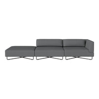 Modern gray sectional sofa with sleek lines and minimalist design, accented by a stylish metal base.