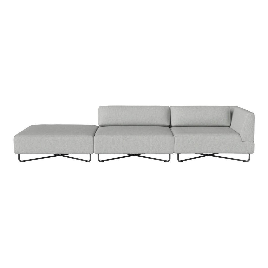 Contemporary gray sectional sofa with clean lines and a minimalist design, featuring a sleek metal base.