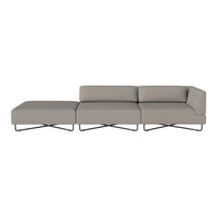 Gray sectional sofa with smooth fabric upholstery and sleek metal legs, showcasing a modern and minimalist design.