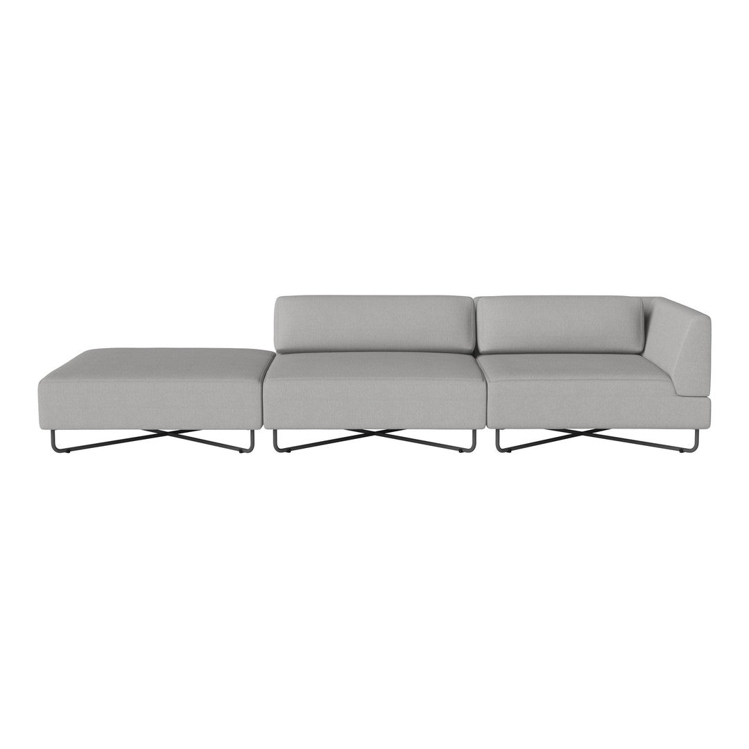Modern grey sectional sofa with smooth fabric upholstery and sleek metal legs. Minimalist design without patterns.