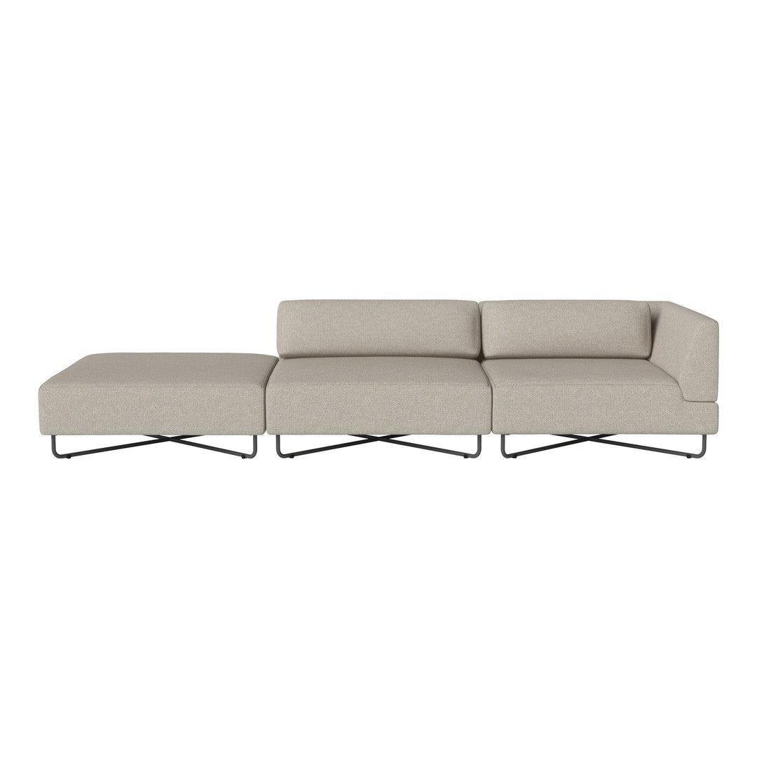 Beige sectional sofa with smooth upholstery and modern metal legs, featuring a minimalist design and clean lines.