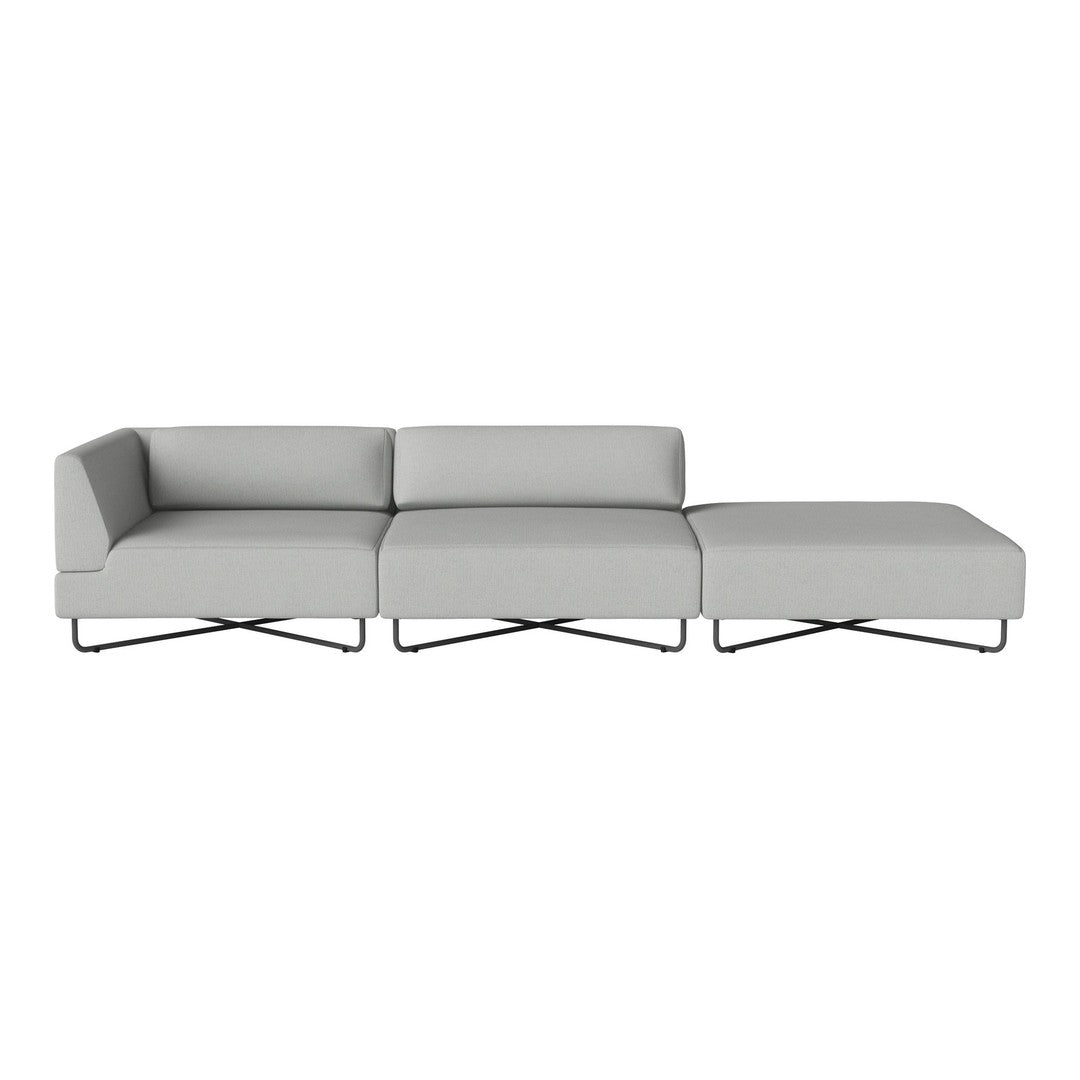 Modern gray sectional sofa with clean lines and a minimalist design, featuring solid color upholstery and sleek metal legs.