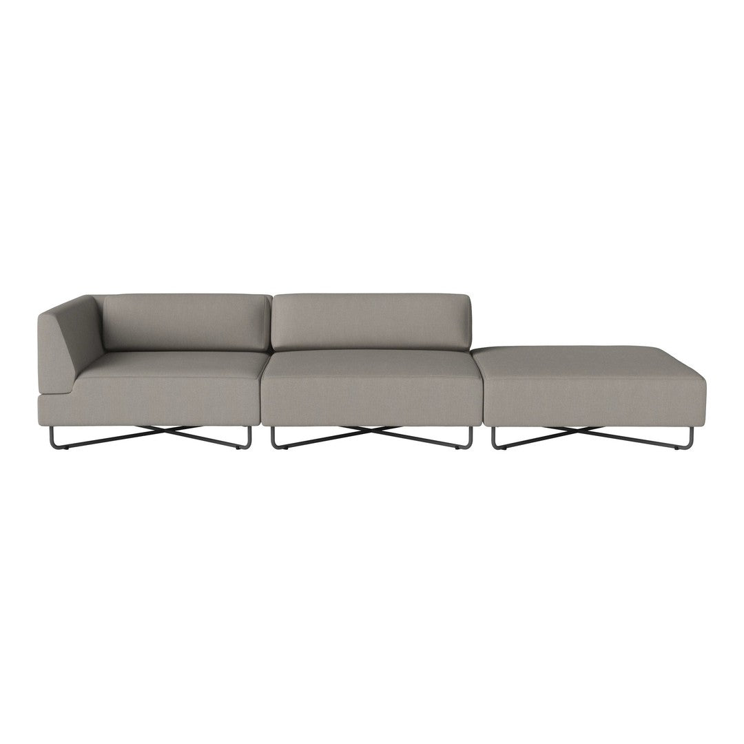 Light gray sectional sofa with a sleek design and minimalist pattern, featuring modern metal legs.