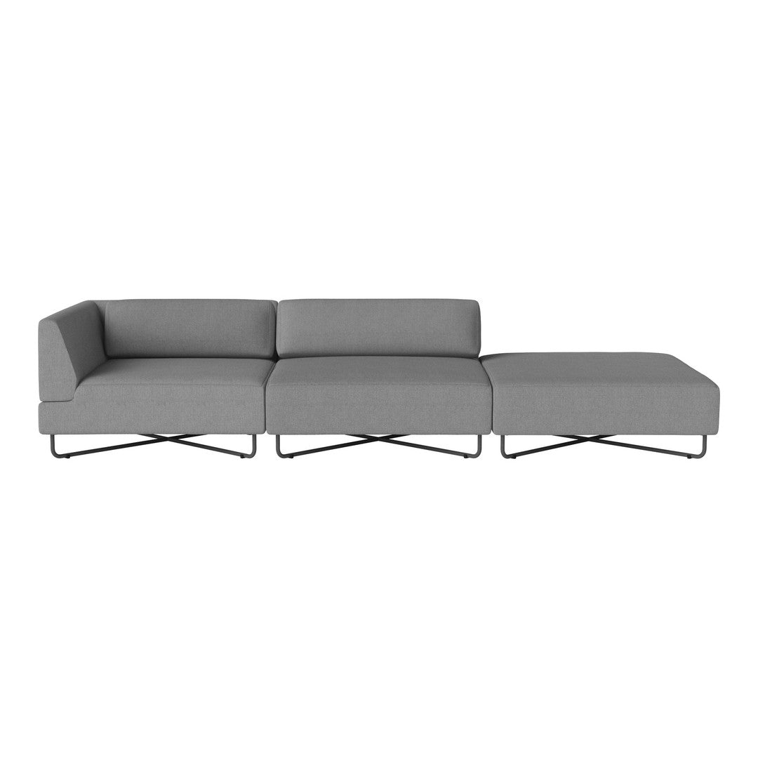 Gray modular sofa with sleek lines and minimalistic design, featuring a smooth fabric texture and chrome legs.