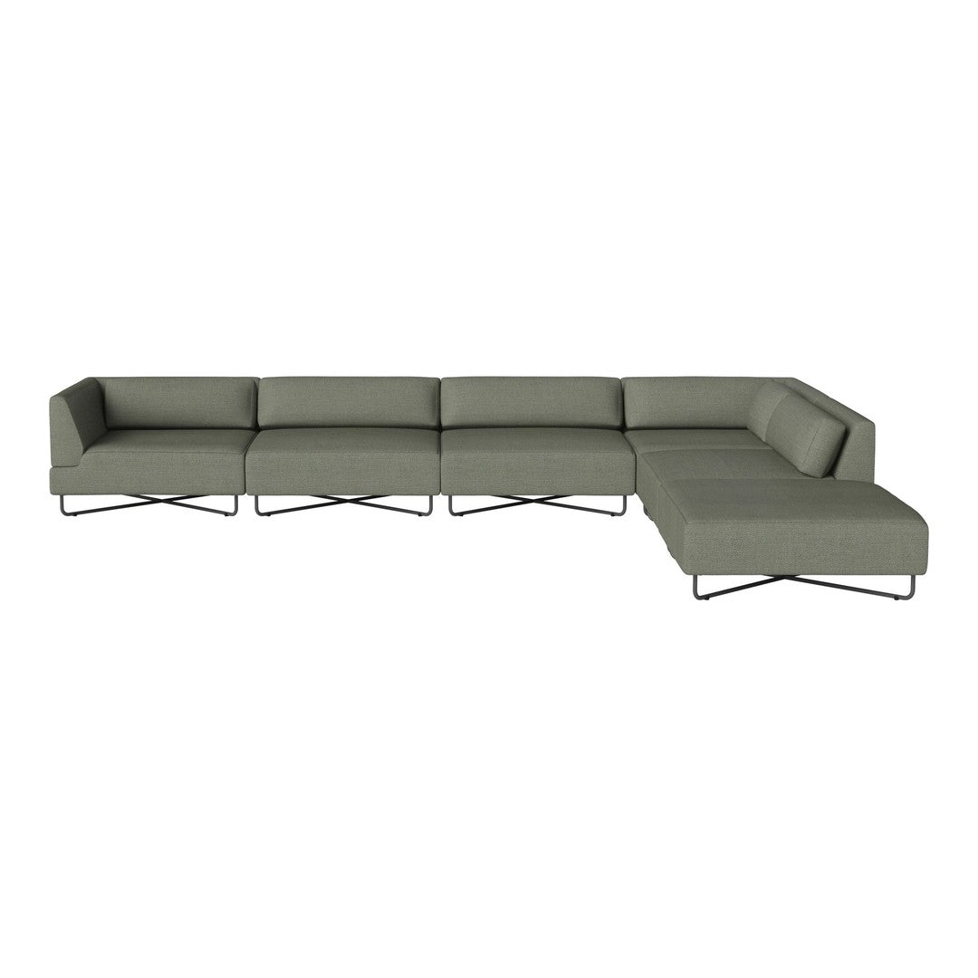 Modern sectional sofa in muted green fabric with a sleek metal frame, featuring a minimalist design and clean lines.