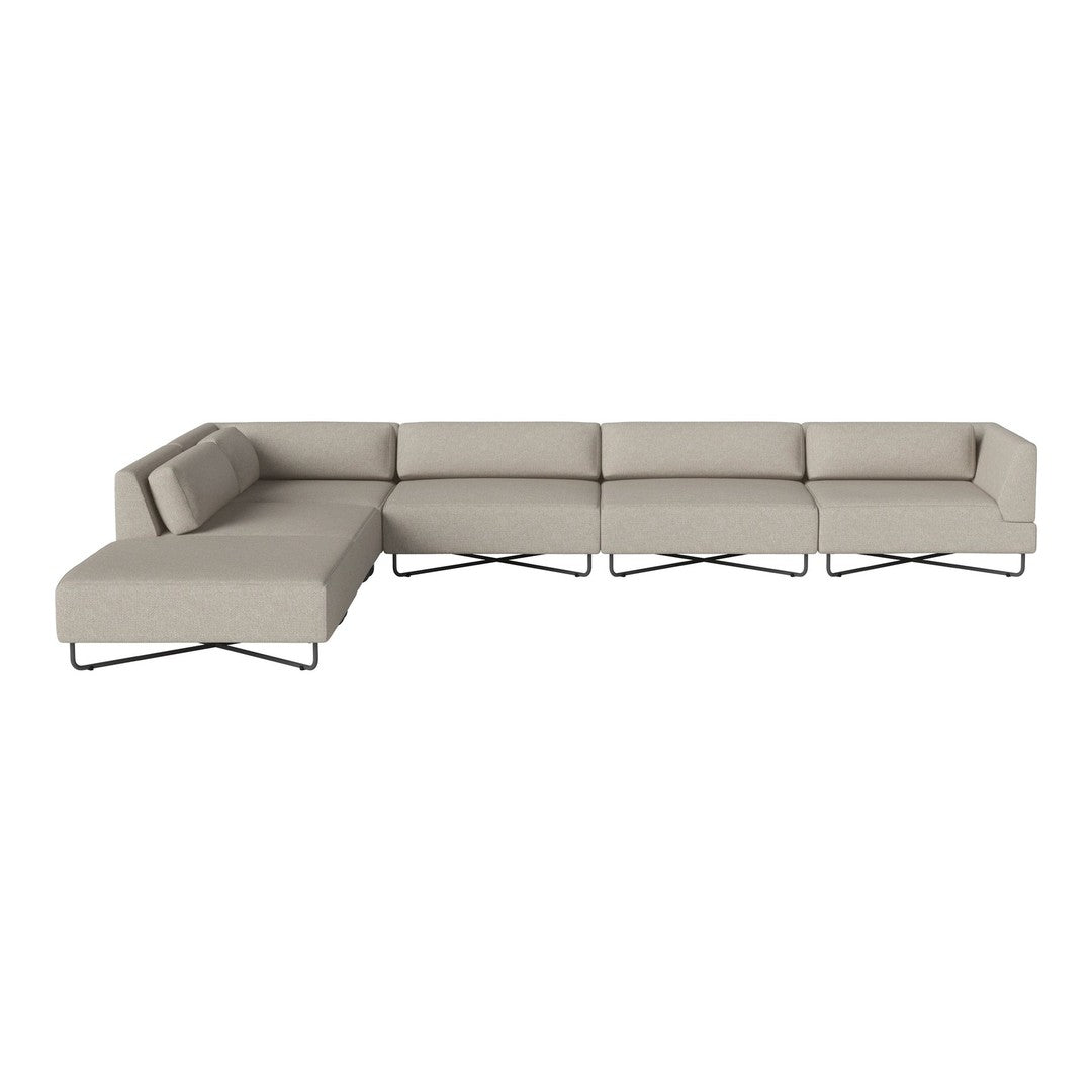 Light beige sectional sofa with clean lines and a minimalist design, featuring solid fabric and no visible patterns.