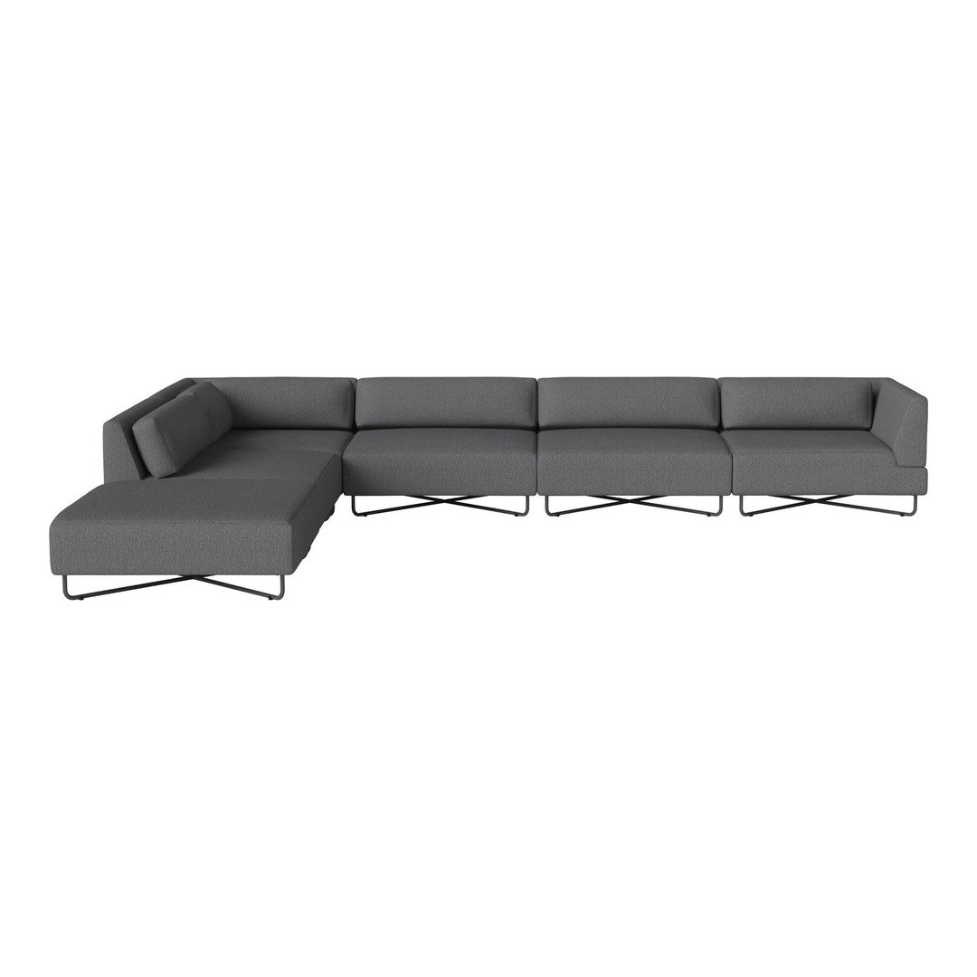 Gray sectional sofa with clean lines and minimalistic design, featuring a solid color upholstery and metallic legs.
