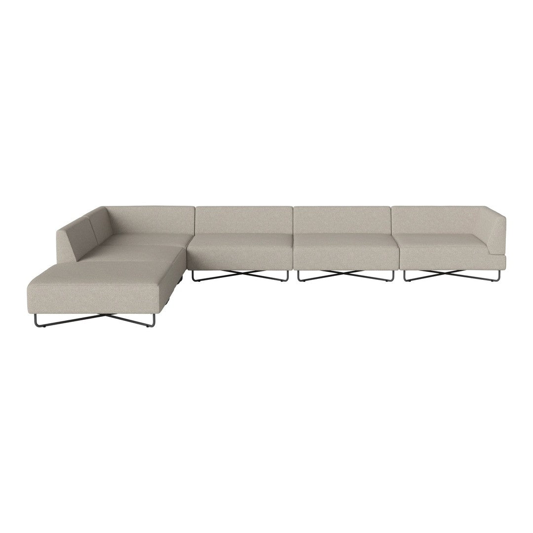 Beige sectional sofa with clean lines, modern design, and metal legs, featuring a minimalist aesthetic.