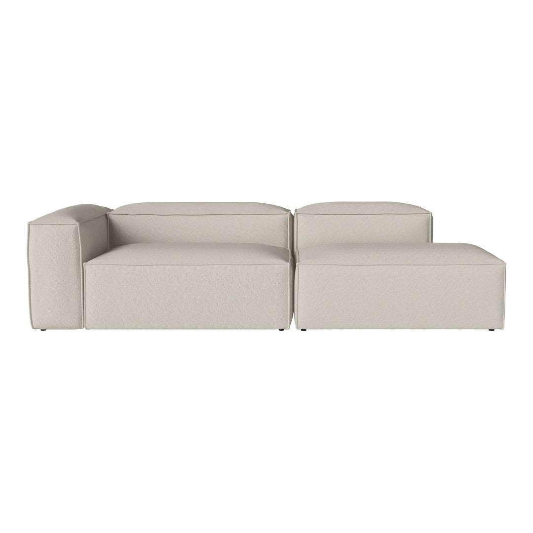 Light gray sectional sofa with a smooth, minimalist design and subtle texture. Perfect for modern interiors.