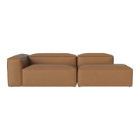 Contemporary brown leather sofa with a sleek, minimalist design and smooth, untextured surfaces.