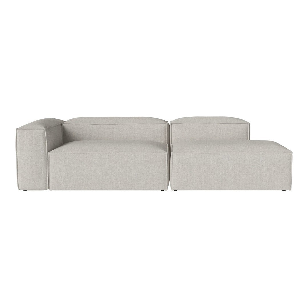 Light grey modular sofa with smooth, minimalist lines and a solid, textured fabric finish. Perfect for modern decor.
