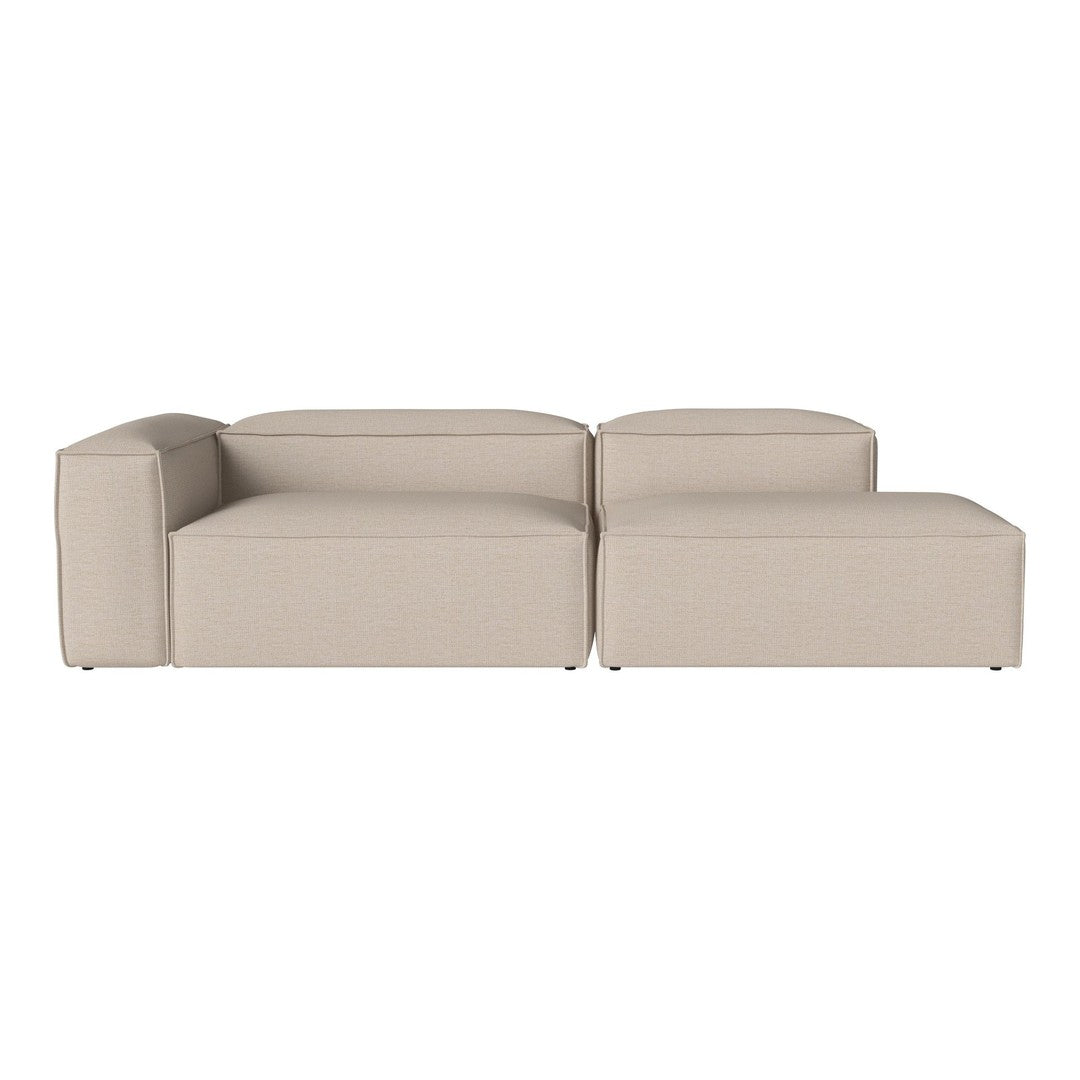 Beige sectional sofa with a modern design; smooth, solid fabric and minimalist shapes for a chic look.