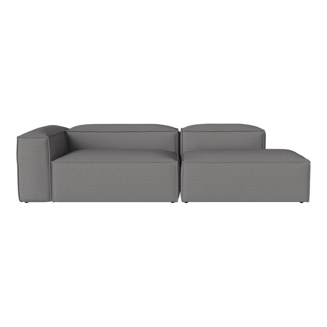 Gray sectional sofa with a modern, minimalistic design and solid color upholstery, perfect for contemporary spaces.