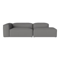Gray sectional sofa with a modern, minimalistic design and solid color upholstery, perfect for contemporary spaces.