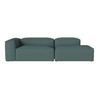 Teal sectional sofa with a minimalist design and smooth texture, featuring a solid color and contemporary style.