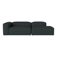 Modern dark gray sectional sofa with a minimalist design and clean lines, perfect for contemporary spaces.