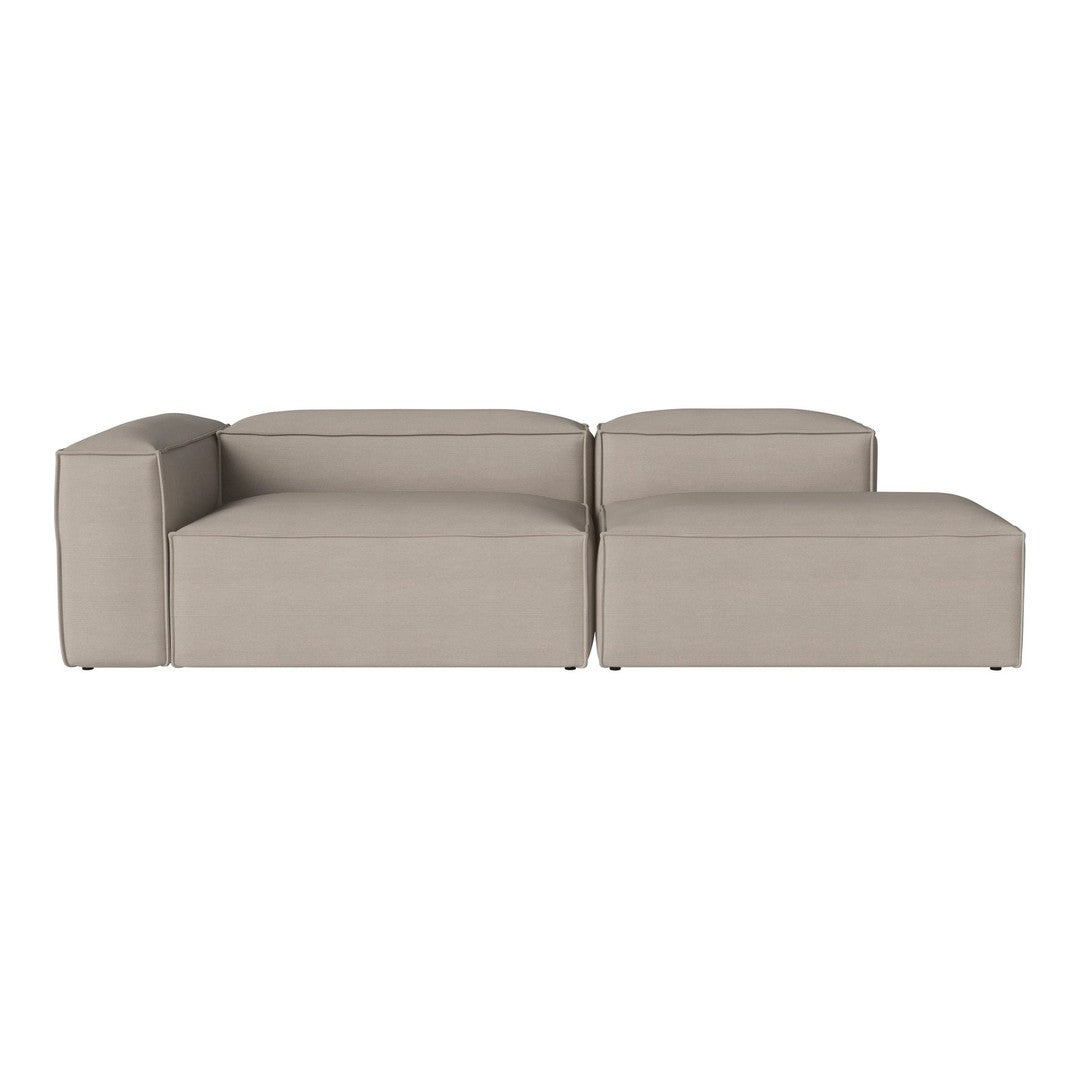 Modern sectional couch in soft beige fabric with a sleek, minimalist design and no distinct patterns.