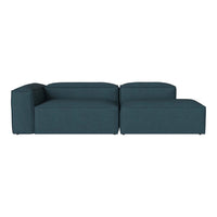 Teal modular sofa with a smooth, textured fabric pattern, showcasing modern design and versatility.