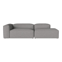 Modern gray sectional sofa with a sleek, minimalist design and smooth, uniform fabric texture.