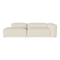 Cream-colored modular sofa with a smooth, minimalist design and subtle textured fabric.