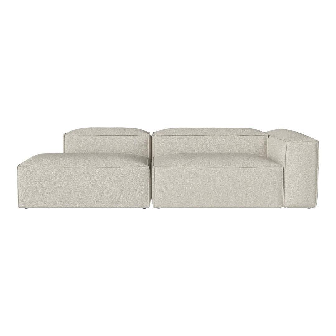 "Contemporary beige sectional sofa with a minimalist design and smooth, clean lines."