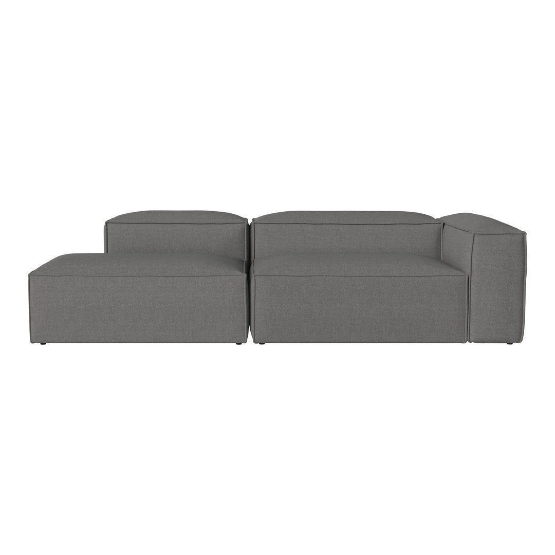 Gray sectional sofa with a minimalist design, featuring smooth, solid fabric and clean lines. Perfect for modern decor.