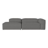 Gray sectional sofa with a minimalist design, featuring smooth, solid fabric and clean lines. Perfect for modern decor.