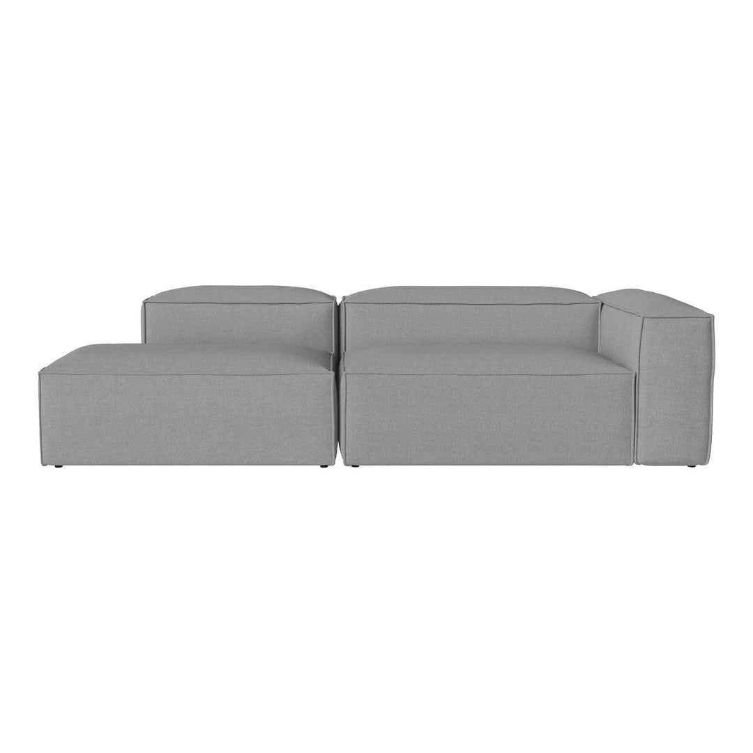 Gray modular sofa with a sleek, modern design and smooth upholstery, perfect for contemporary living spaces.