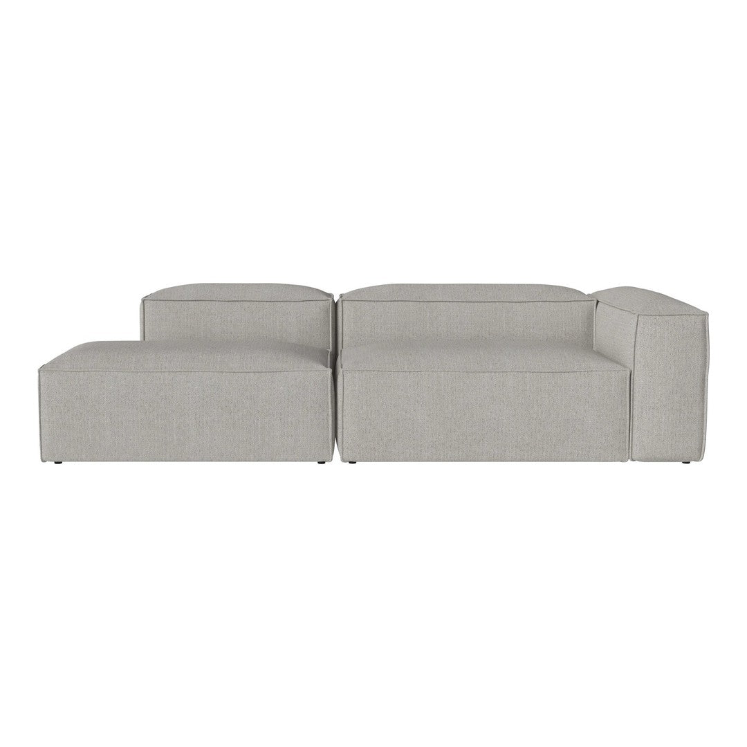 Light gray sectional sofa with a minimalist design and soft, textured upholstery.