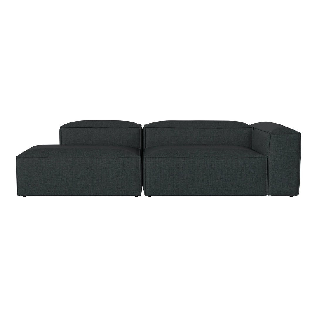 Dark green sectional sofa with sleek lines and a minimalist design, perfect for modern living spaces.