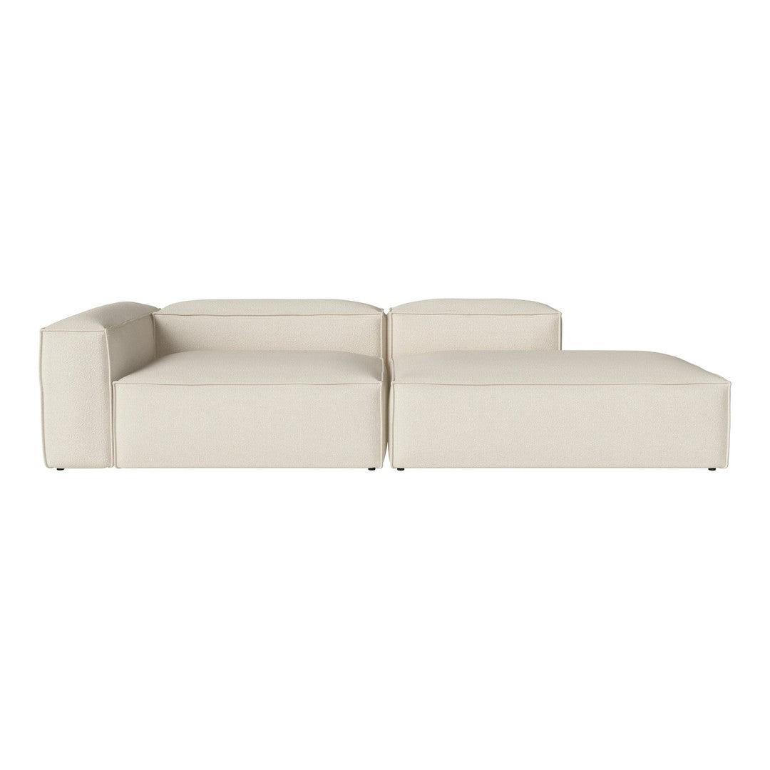 Cream-colored modular sofa with a sleek, minimalist design and smooth, solid upholstery. Perfect for modern decor.