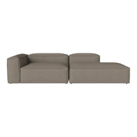 Modern sectional sofa in a warm taupe color with a smooth, minimalist design and no visible patterns.