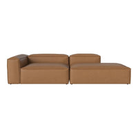 Brown leather sectional sofa with a minimalist design and clean lines, perfect for modern living spaces.