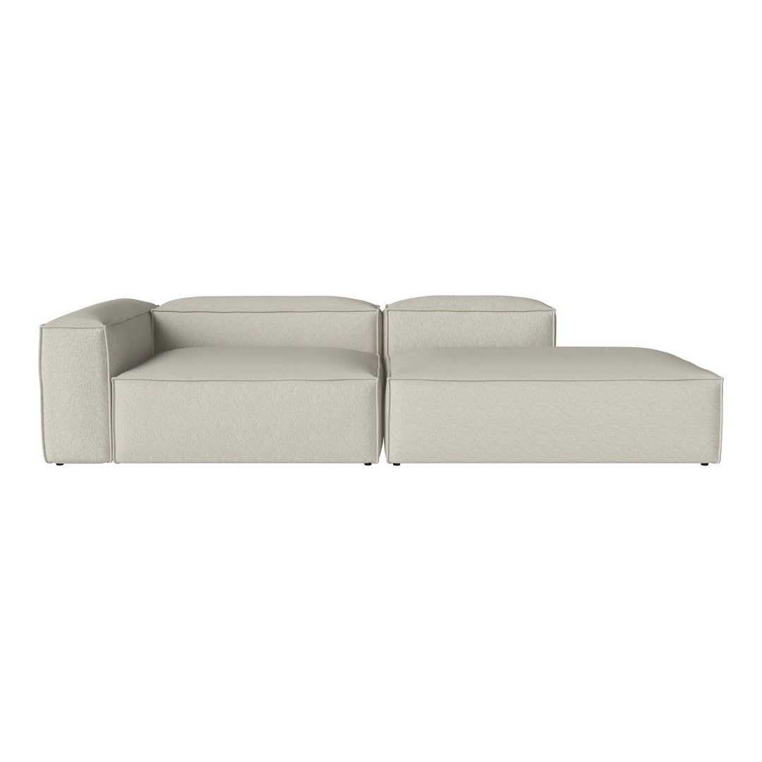 Modern beige sectional sofa with sleek lines and minimalist design, perfect for any contemporary living space.