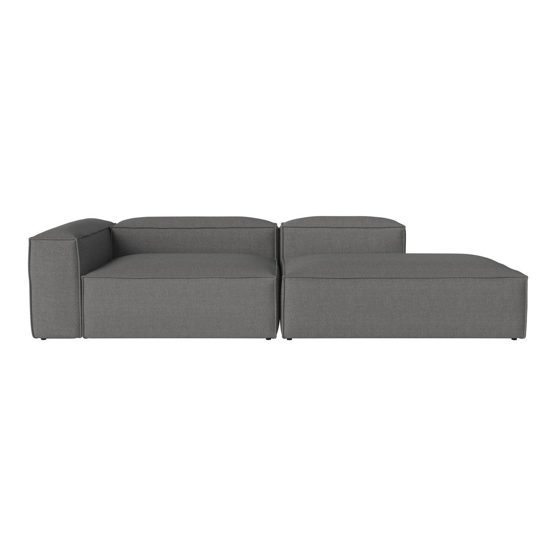 Modern gray sectional sofa with a sleek, minimalistic design and soft fabric upholstery.