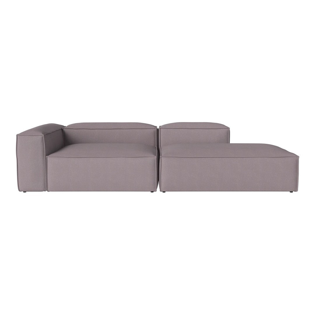 Modern grey sectional sofa with clean lines and minimalistic design, featuring a solid color upholstery.