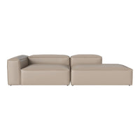Beige leather sectional sofa with sleek, modern lines and minimalistic design, perfect for contemporary spaces.