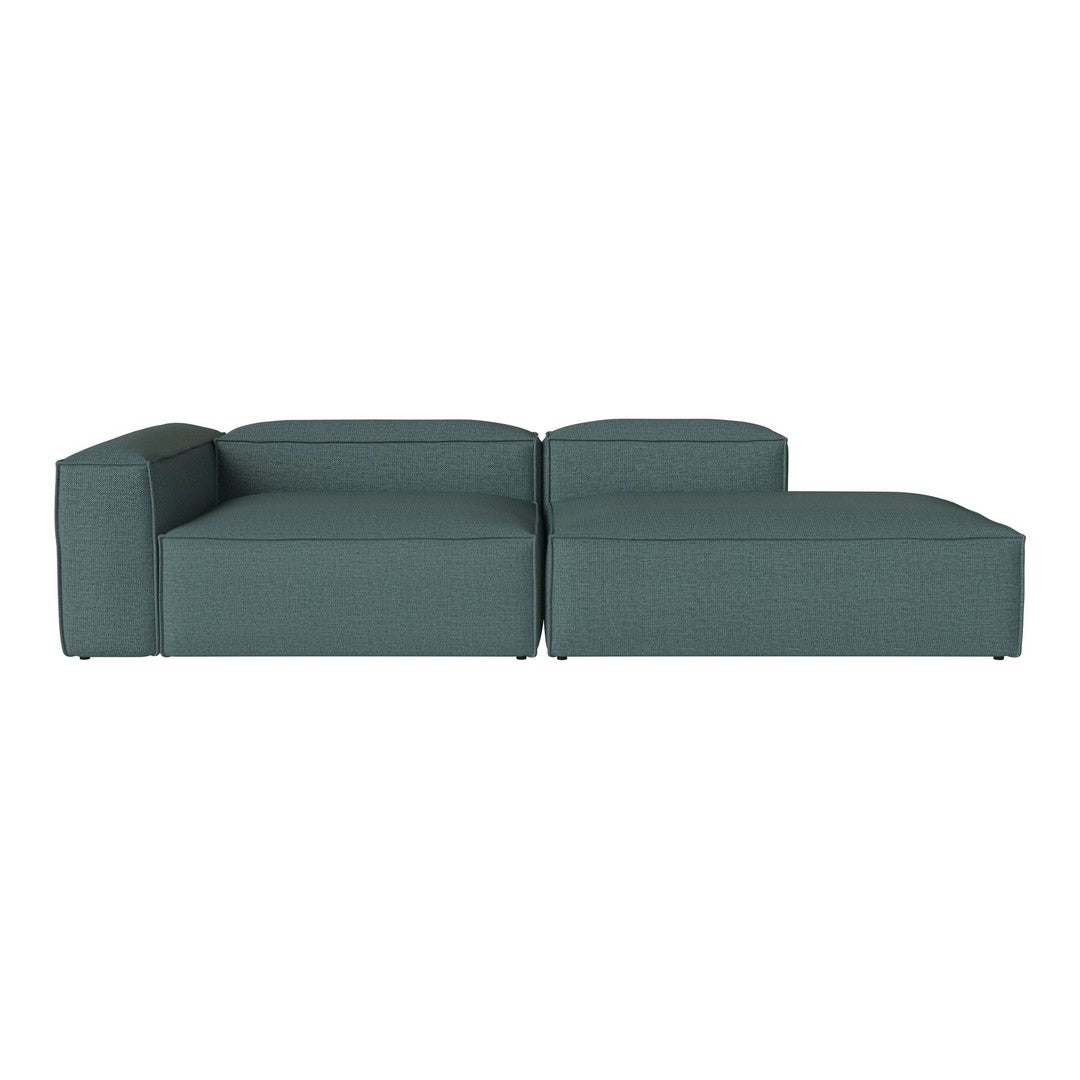 Teal sectional sofa with a modern, minimalist design and clean lines, featuring a solid, textured fabric.